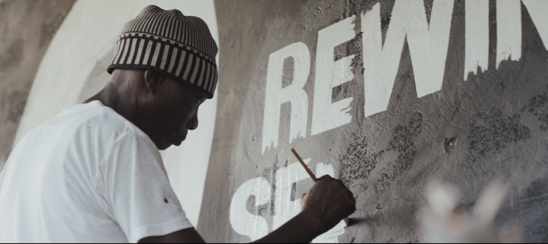 Rewind Selecta — hand-painting the sign
